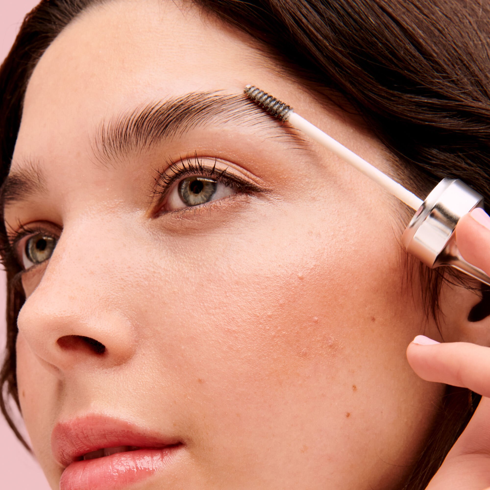 model applying Fluff Up Brow